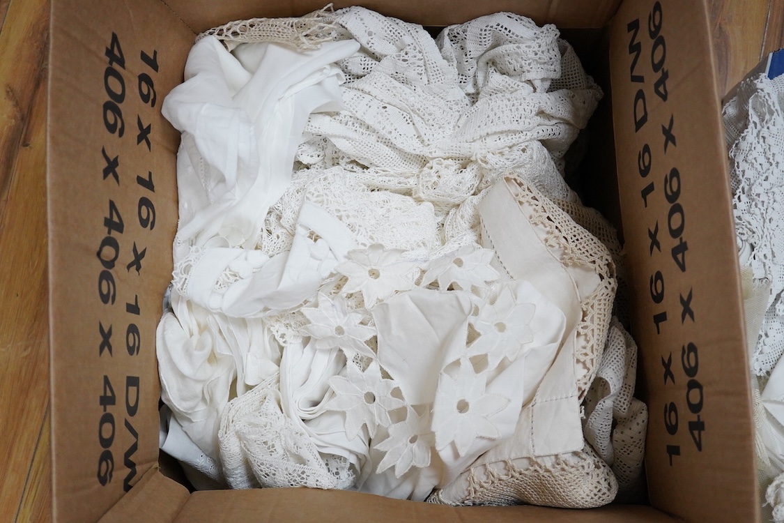 Two boxes of mixed white on white embroidered linen and cotton table cloths etc, some with crochet edging and cut work.